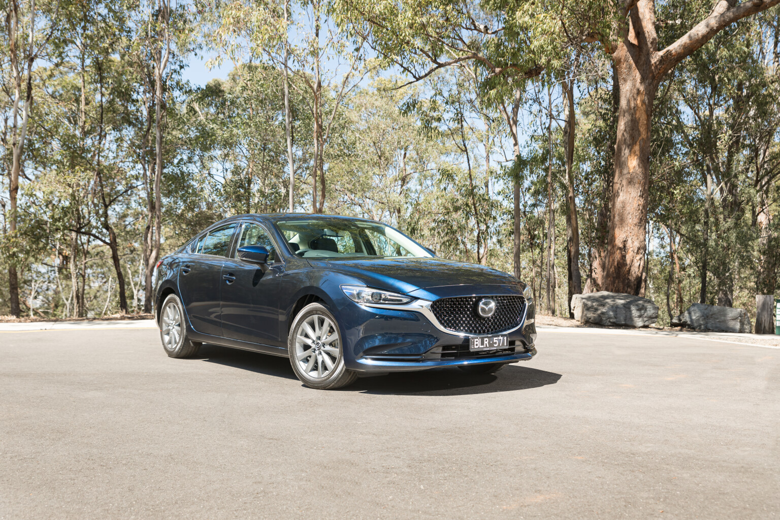 ca510a92/2021 mazda 6 sports sedan deep crystal blue mica static front side australia mwilliams jpg