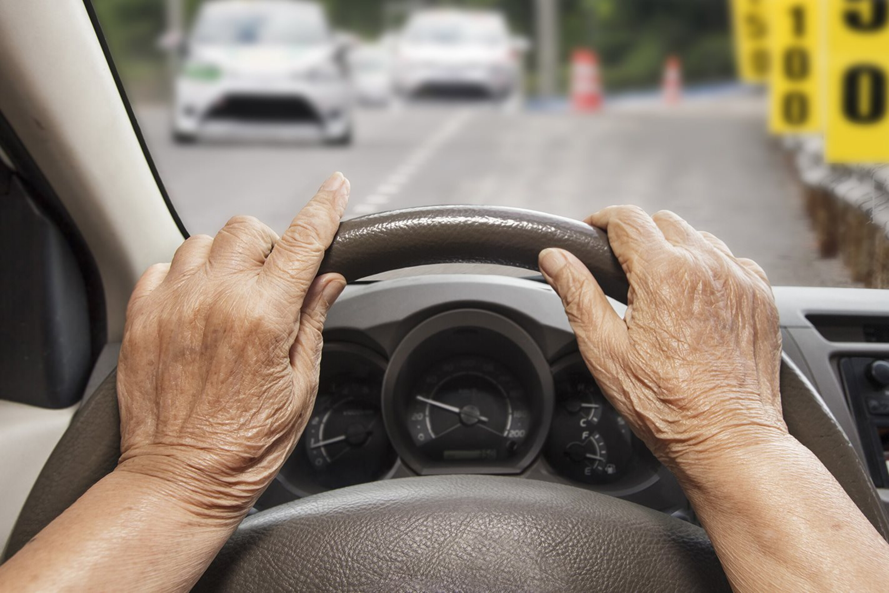 b7a109c3/elderly hands on car steering wheel driving jpg