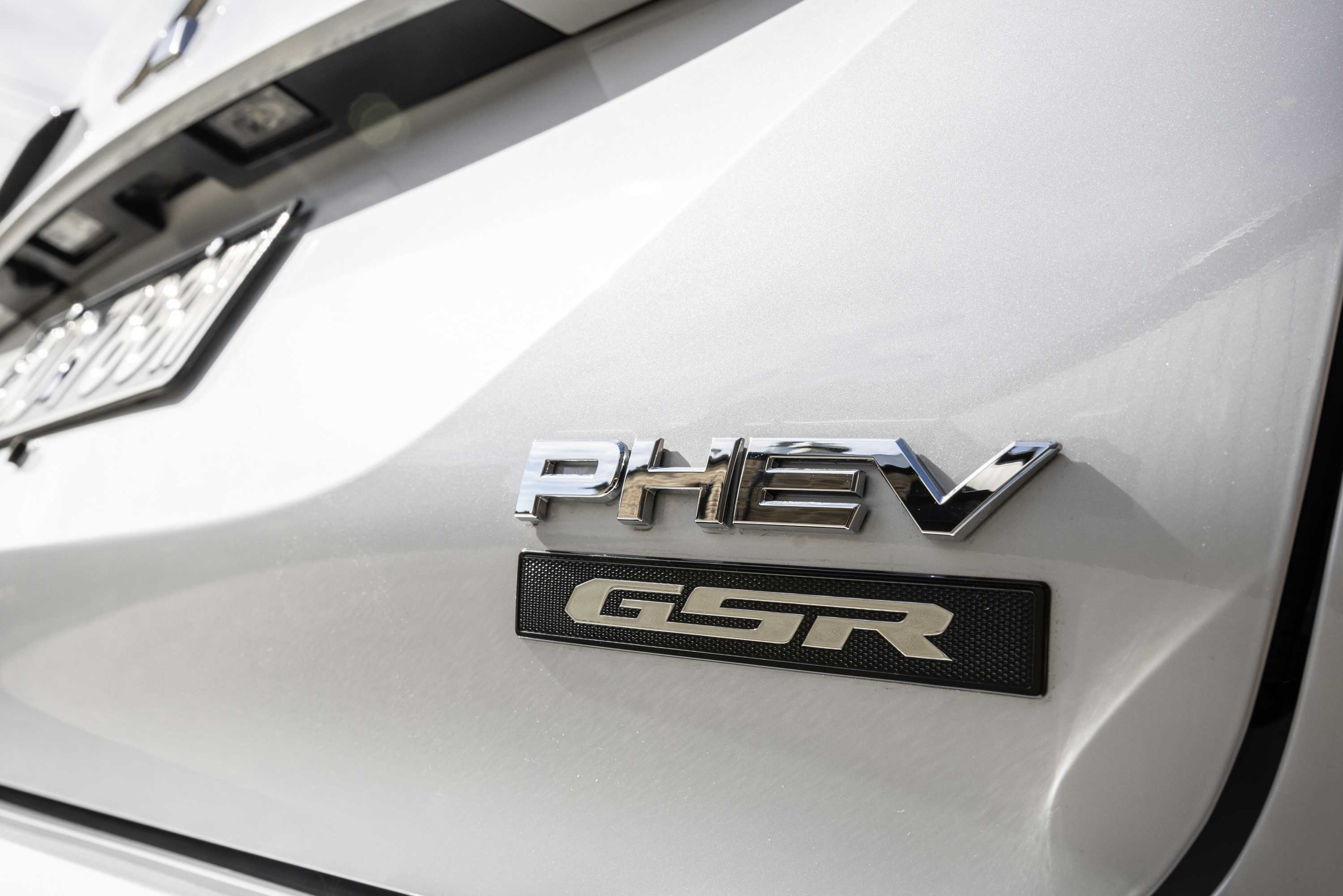 2f9a16af/mitsubishi outlander phev gsr badge 01 jpg