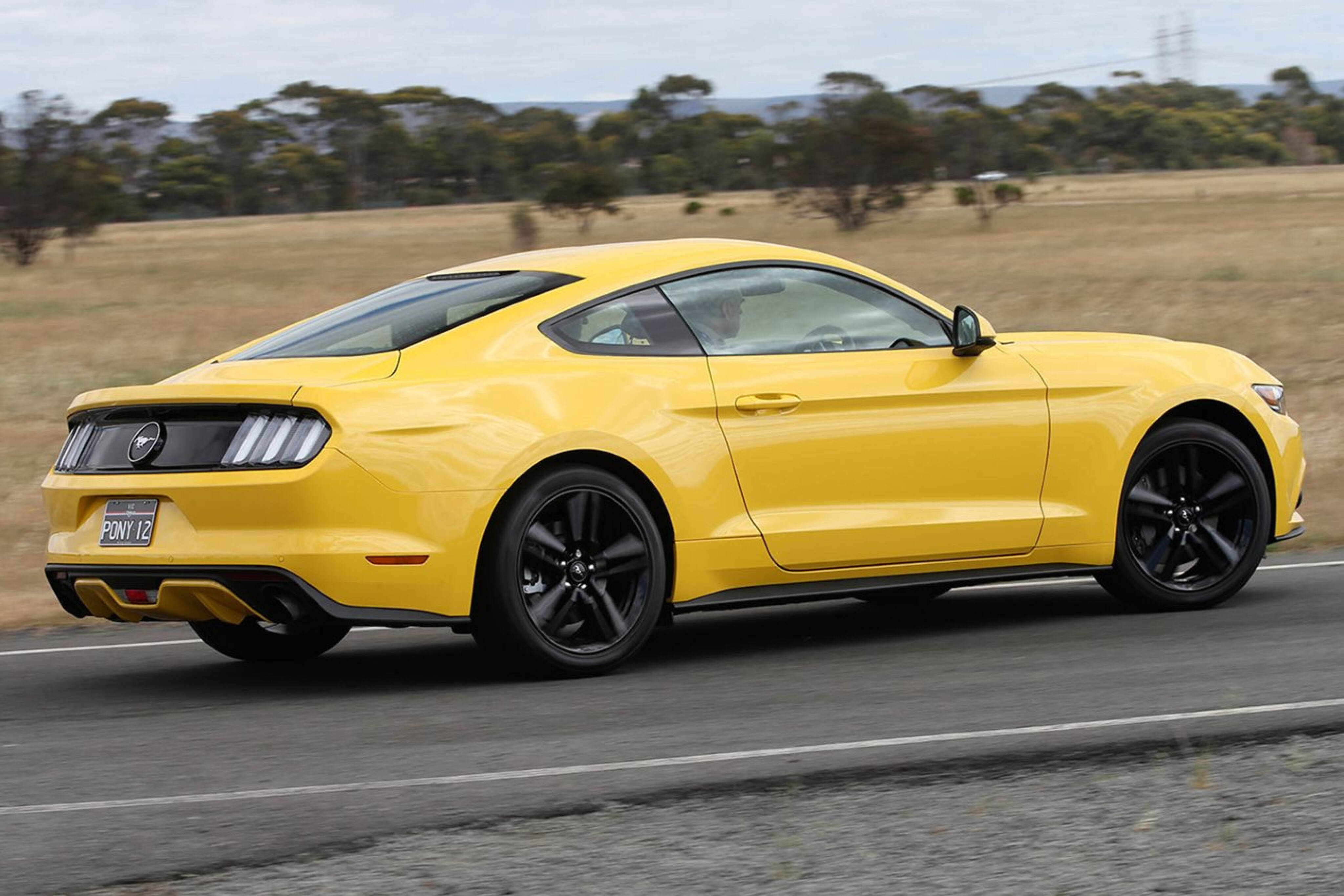c1e20aaa/ford mustang yellow driving jpg